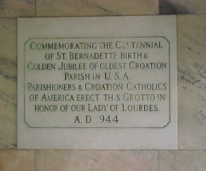 Dedication plaque inside the grotto chapel